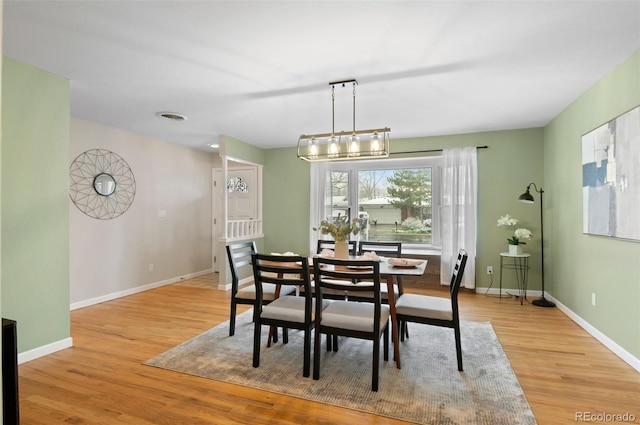 3190 Ward Ct, Wheat Ridge, CO 80215 - dining space with light wood finished floors and baseboards