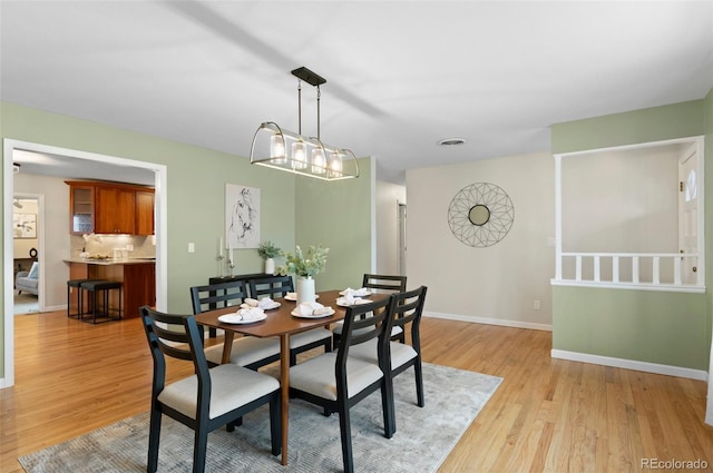 3190 Ward Ct, Wheat Ridge, CO 80215 - dining space featuring light wood-type flooring and baseboards
