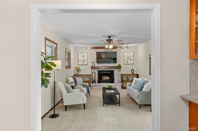 3190 Ward Ct, Wheat Ridge, CO 80215 - carpeted living room with a fireplace and a ceiling fan