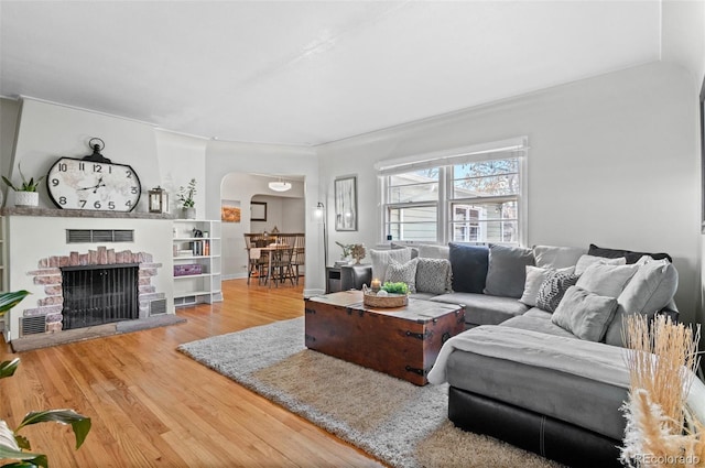 living room featuring a fireplace and hardwood / wood-style floors