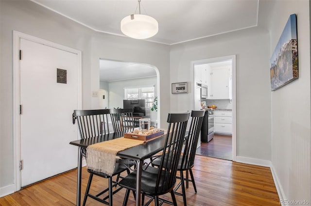 dining area featuring light wood-type flooring