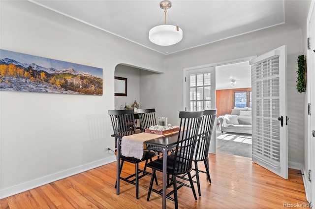 dining area with light hardwood / wood-style floors