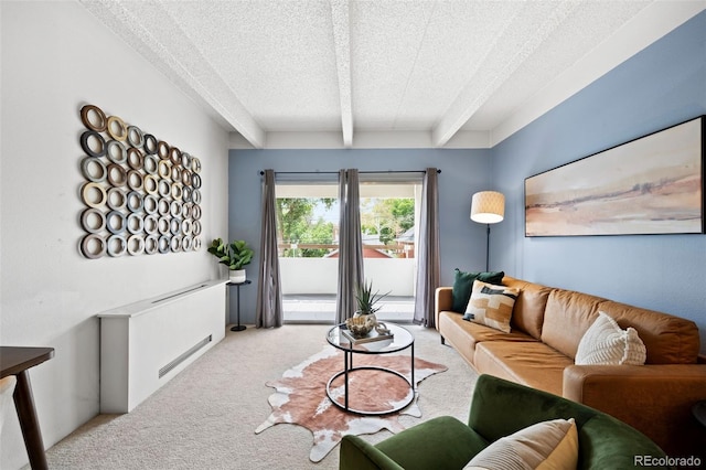 carpeted living room featuring a textured ceiling and beamed ceiling