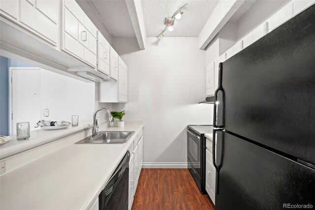 kitchen featuring sink, dark hardwood / wood-style floors, a textured ceiling, black appliances, and white cabinets