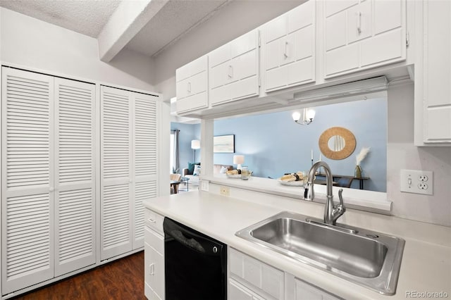 kitchen with sink, white cabinetry, dark hardwood / wood-style floors, and dishwasher