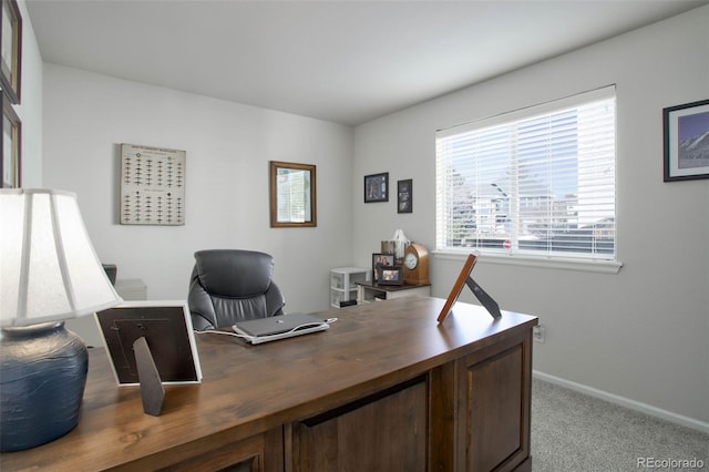carpeted office space with baseboards