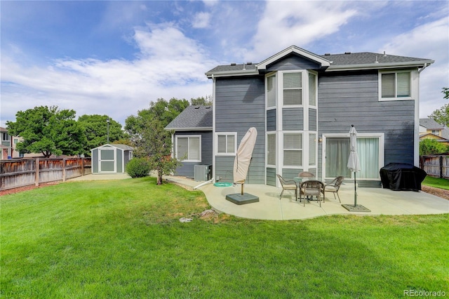 rear view of house featuring a patio area, a storage shed, central AC, an outdoor structure, and roof with shingles