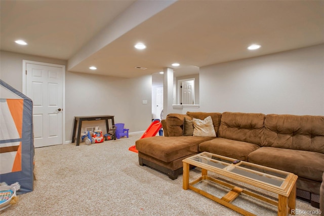 carpeted living area with recessed lighting and baseboards
