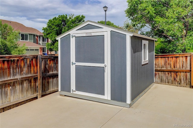 view of shed featuring a fenced backyard