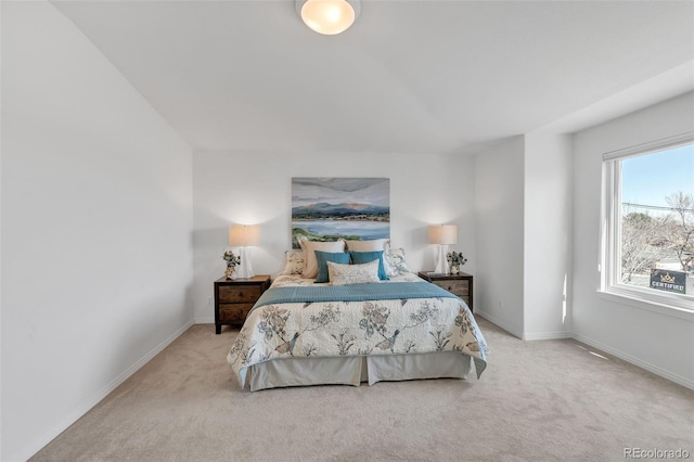 carpeted bedroom with baseboards