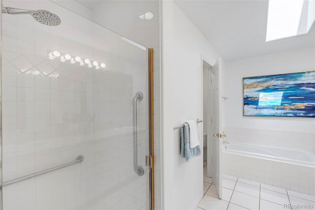 bathroom with tile patterned flooring, a bath, and a stall shower