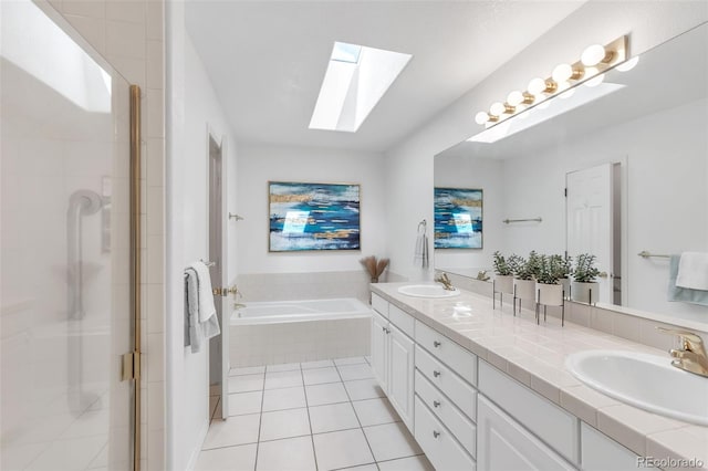full bathroom with a bath, a sink, double vanity, a stall shower, and a skylight