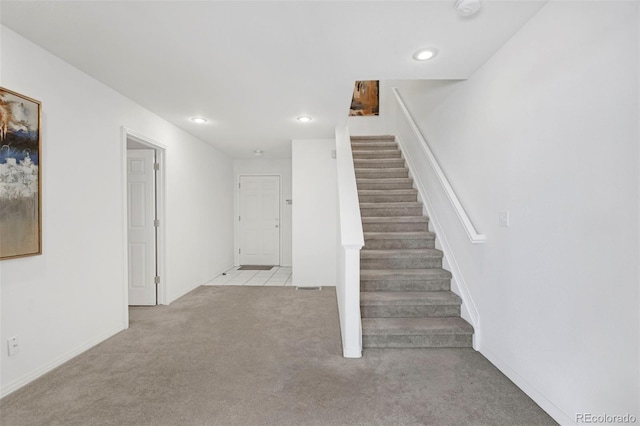 stairway with recessed lighting, carpet floors, and baseboards