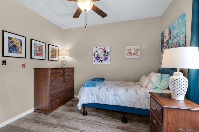 bedroom with ceiling fan and light wood-type flooring