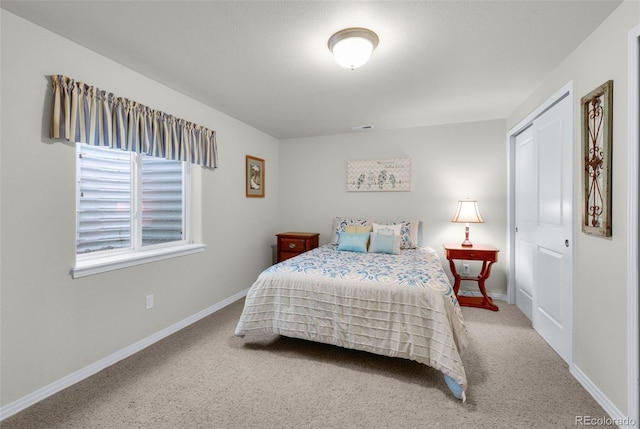 bedroom with a closet and carpet flooring