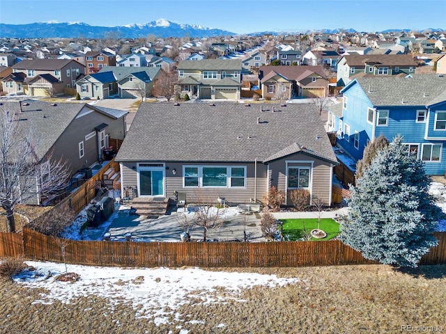 snow covered property with a mountain view