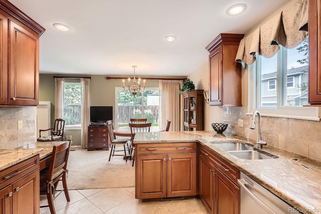 3544 Dyanna Dr, Thornton, CO 80241 - kitchen featuring dishwasher, light carpet, brown cabinets, light stone countertops, and recessed lighting