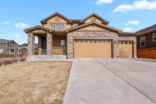 craftsman inspired home with a garage and covered porch