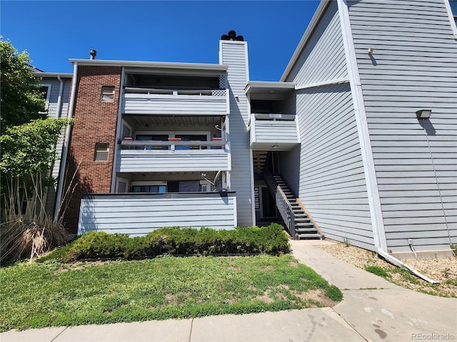 14499 E 1st Dr Unit A05, Aurora, CO 80011 - view of building exterior with stairs