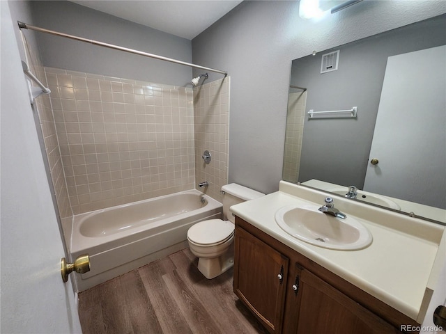 14499 E 1st Dr Unit A05, Aurora, CO 80011 - bathroom with wood finished floors, bathtub / shower combination, vanity, and toilet