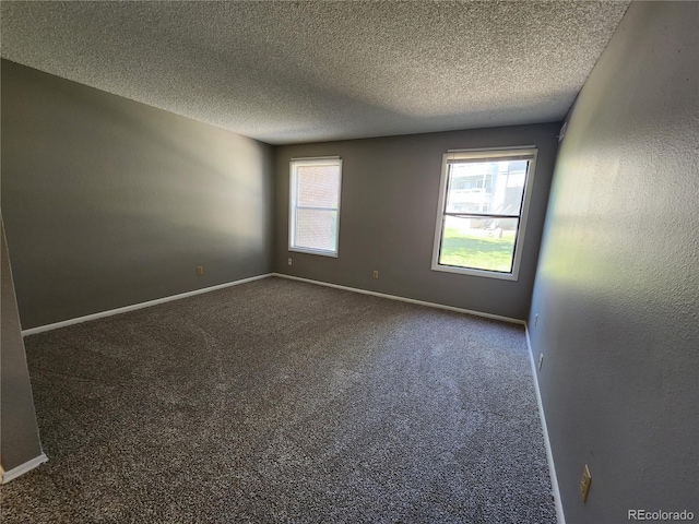 14499 E 1st Dr Unit A05, Aurora, CO 80011 - carpeted empty room featuring a textured ceiling and baseboards