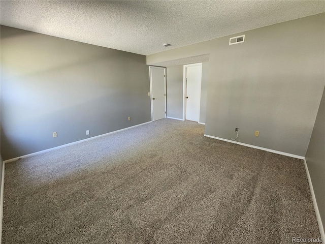 14499 E 1st Dr Unit A05, Aurora, CO 80011 - empty room featuring carpet flooring, a textured ceiling, and baseboards