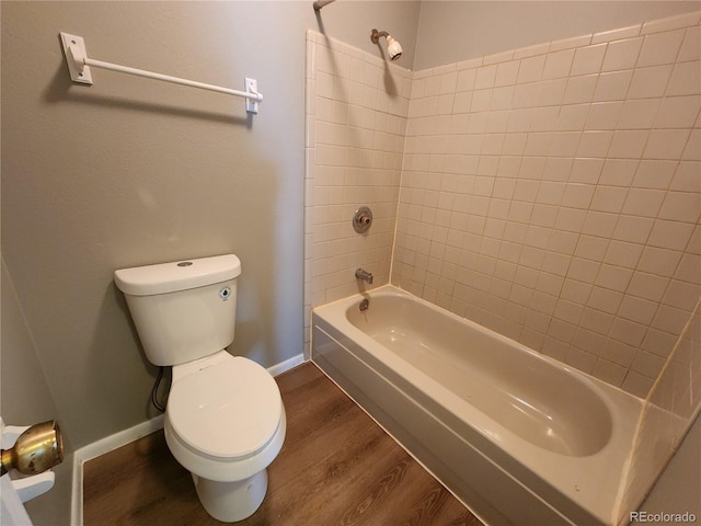 14499 E 1st Dr Unit A05, Aurora, CO 80011 - full bath featuring wood finished floors, toilet, shower / bathtub combination, and baseboards