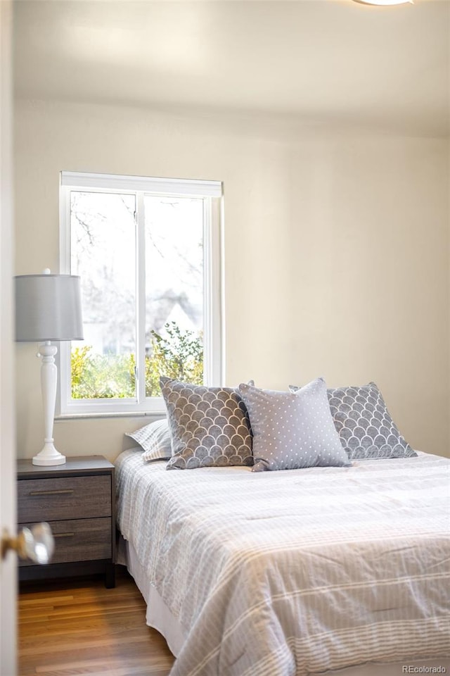 bedroom with wood finished floors