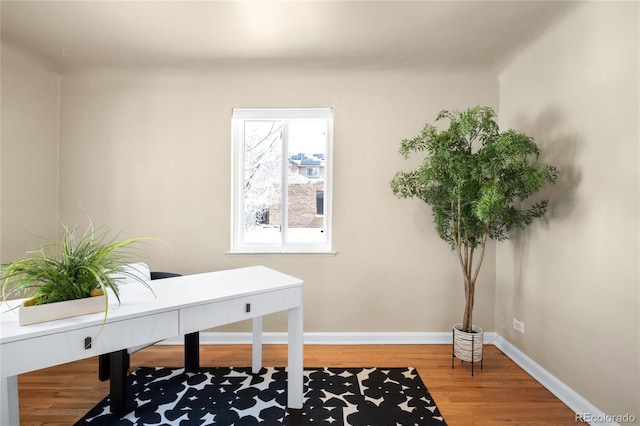 office area with wood finished floors and baseboards