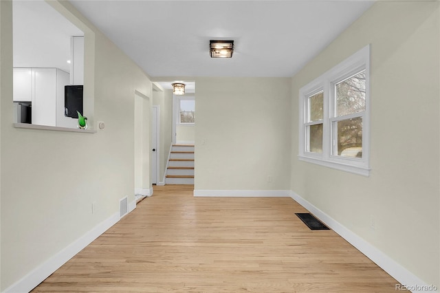 corridor featuring light hardwood / wood-style flooring