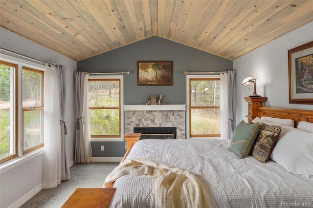 bedroom featuring wood ceiling, vaulted ceiling, and light colored carpet