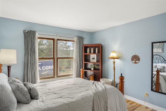 bedroom with light hardwood / wood-style flooring