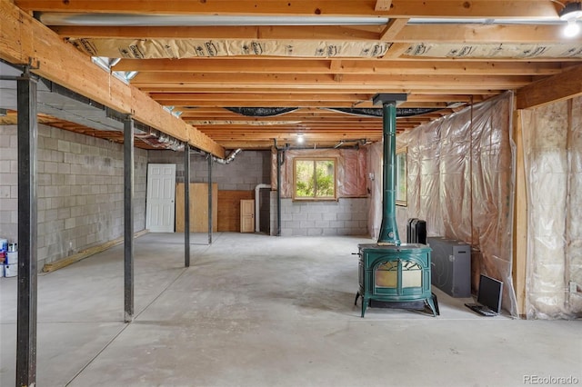 basement featuring a wood stove