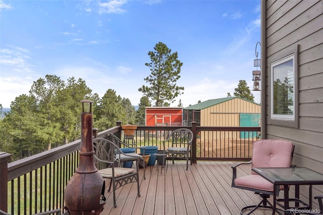 wooden deck featuring a storage shed