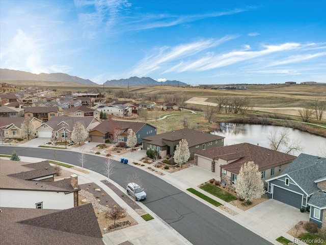 aerial view with a residential view and a water and mountain view