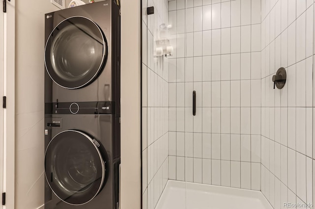 2120 N Downing St Unit 216, Denver, CO 80205 - washroom with stacked washer / dryer