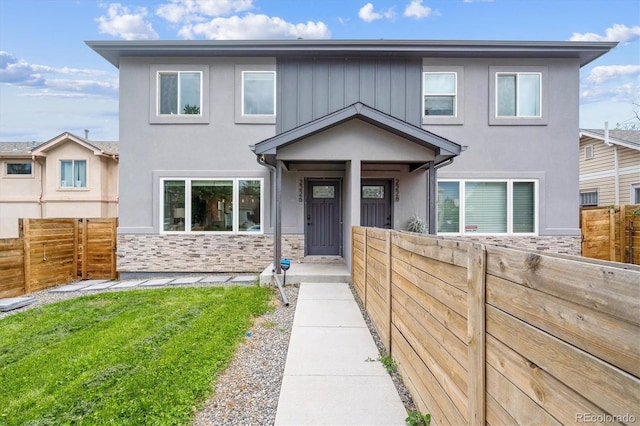 2226 S Galapago St, Denver, CO 80223 - view of front facade with stone siding and stucco siding
