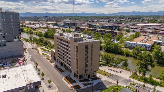 drone / aerial view with a mountain view and a view of city