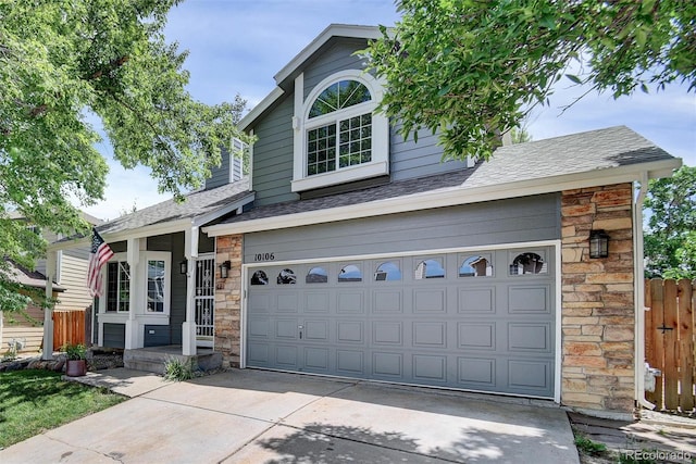 10106 Westside Cir, Littleton, CO 80125 - traditional-style home featuring stone siding, concrete driveway, a garage, and roof with shingles