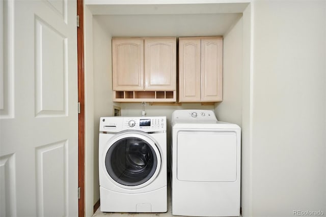 10106 Westside Cir, Littleton, CO 80125 - washroom with cabinet space and independent washer and dryer