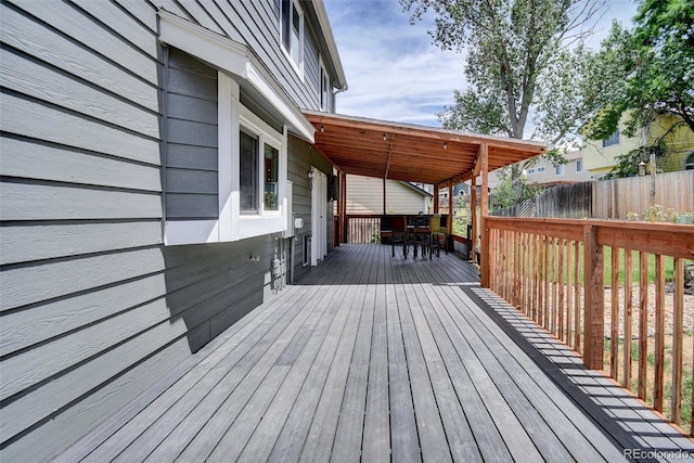 10106 Westside Cir, Littleton, CO 80125 - wooden deck featuring outdoor dining area