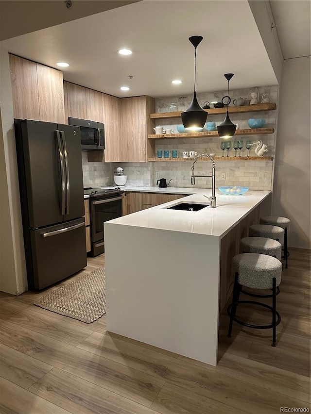 kitchen featuring freestanding refrigerator, electric range, stainless steel microwave, open shelves, and recessed lighting