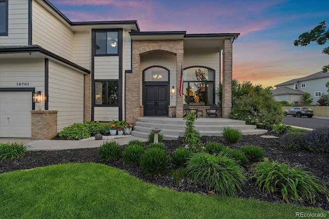 10701 Flagler Dr, Parker, CO 80134 - view of front facade with brick siding and a porch