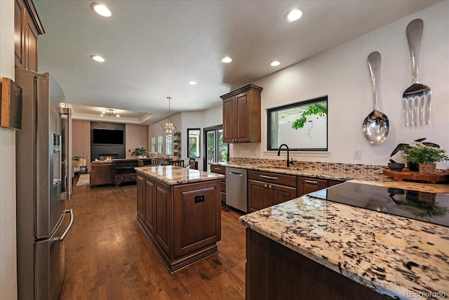 10701 Flagler Dr, Parker, CO 80134 - kitchen featuring appliances with stainless steel finishes, a sink, recessed lighting, open floor plan, and dark wood-style floors