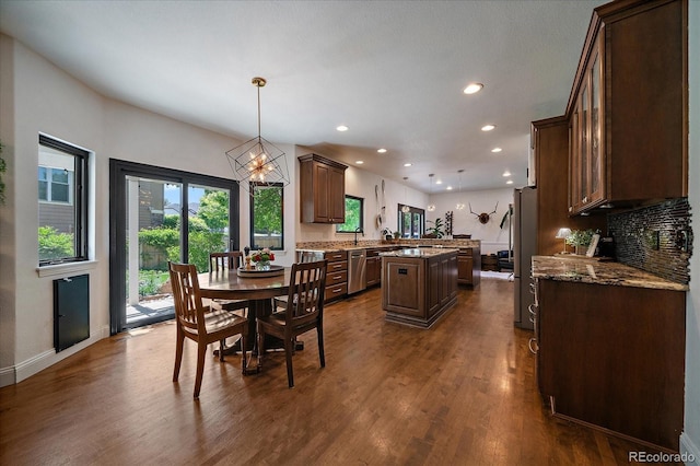 10701 Flagler Dr, Parker, CO 80134 - dining area featuring dark wood-type flooring, recessed lighting, a chandelier, and baseboards
