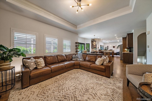 10701 Flagler Dr, Parker, CO 80134 - living area featuring ornamental molding, dark wood-type flooring, a chandelier, a raised ceiling, and recessed lighting