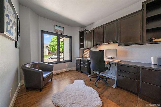 10701 Flagler Dr, Parker, CO 80134 - office with dark wood finished floors, baseboards, and built in study area