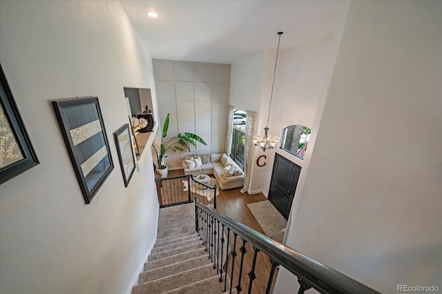 10701 Flagler Dr, Parker, CO 80134 - staircase with wood finished floors, a chandelier, and recessed lighting