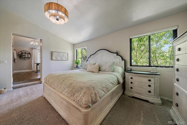 10701 Flagler Dr, Parker, CO 80134 - bedroom with carpet, a chandelier, vaulted ceiling, and baseboards