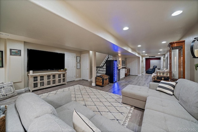 10701 Flagler Dr, Parker, CO 80134 - living area featuring baseboards, wood finished floors, stairway, and recessed lighting